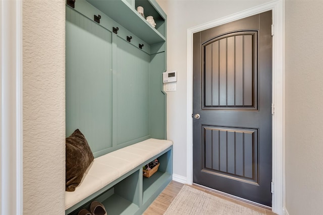 mudroom with light wood-style floors