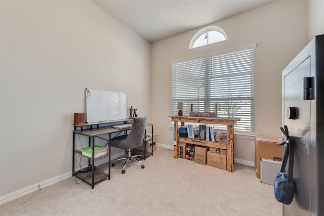 carpeted home office with baseboards