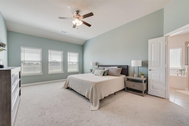 tiled bedroom with a ceiling fan, visible vents, carpet floors, baseboards, and vaulted ceiling