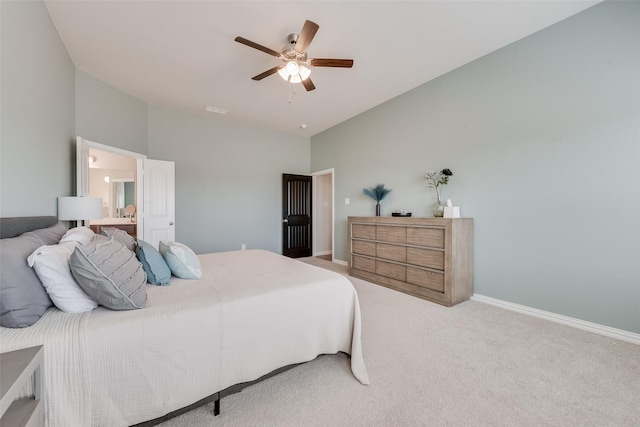 carpeted bedroom featuring lofted ceiling, visible vents, baseboards, and ceiling fan