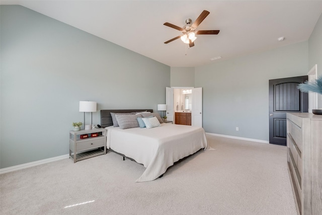 bedroom with vaulted ceiling, a ceiling fan, baseboards, and light carpet