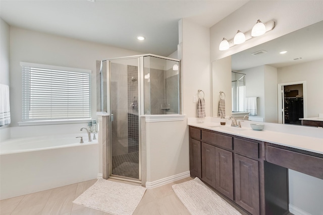 full bath with vanity, a shower stall, visible vents, and tile patterned flooring