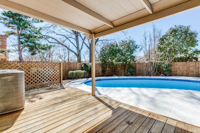 view of pool featuring central air condition unit, a fenced backyard, and a fenced in pool