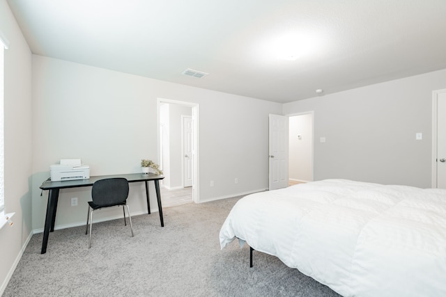 bedroom featuring carpet, visible vents, and baseboards