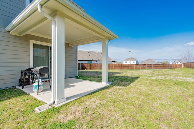 view of yard featuring a patio and fence