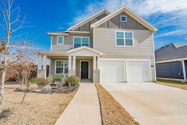 craftsman inspired home featuring an attached garage, board and batten siding, covered porch, and driveway