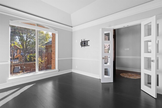 empty room with dark wood finished floors, french doors, and baseboards