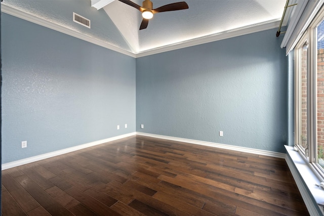 empty room featuring dark wood finished floors, visible vents, and baseboards