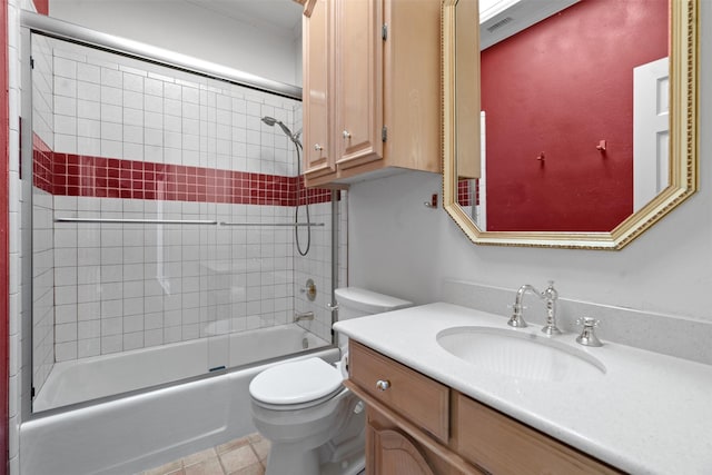 bathroom featuring vanity, toilet, and combined bath / shower with glass door