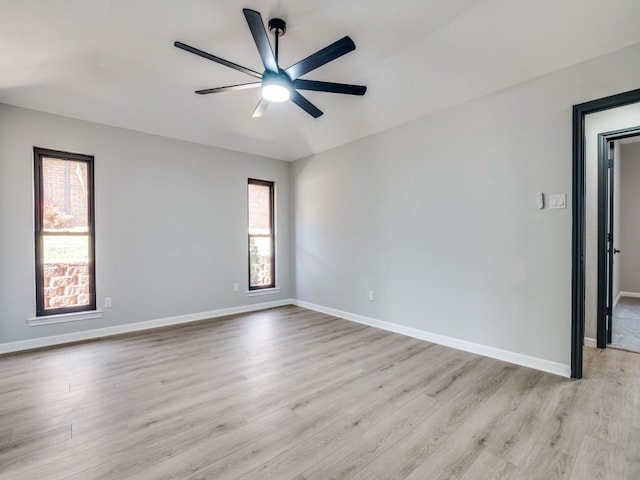 spare room with a healthy amount of sunlight and baseboards