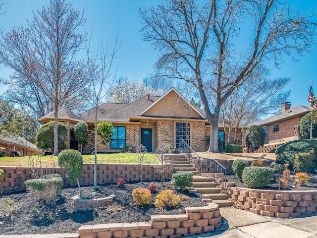 view of front of house featuring brick siding