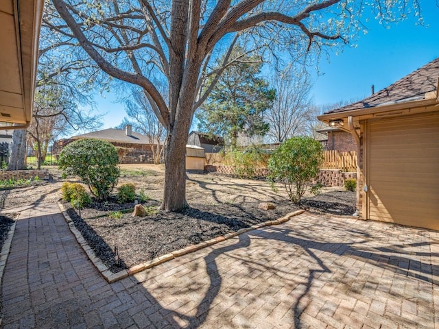 view of yard with a patio and fence