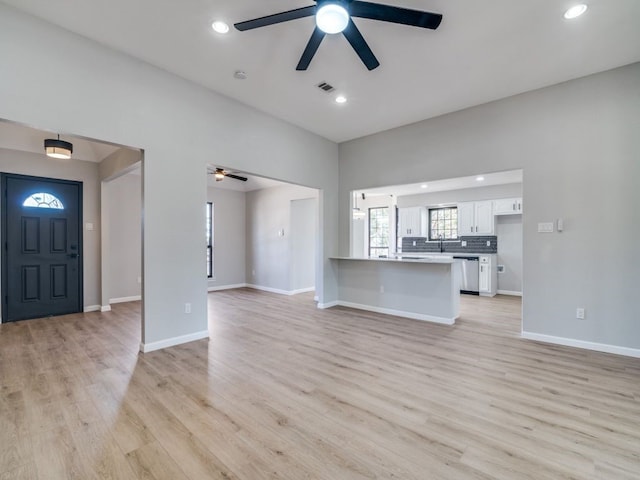 unfurnished living room featuring visible vents, recessed lighting, and light wood-style floors