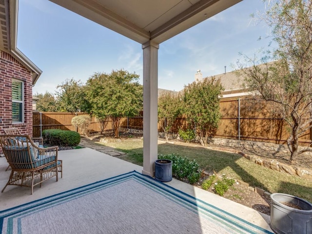 view of patio with a fenced backyard