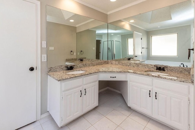 full bath with tile patterned floors, ornamental molding, double vanity, and a sink