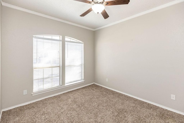 unfurnished room with plenty of natural light, a ceiling fan, ornamental molding, and carpet flooring