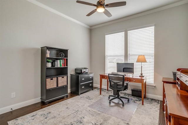 office with wood finished floors, baseboards, a healthy amount of sunlight, and ornamental molding