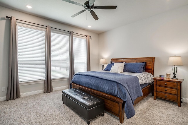 carpeted bedroom featuring a ceiling fan, multiple windows, recessed lighting, and baseboards