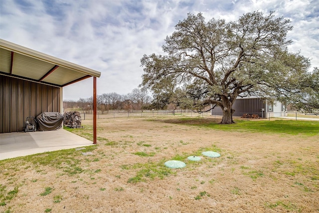 view of yard with a patio and fence