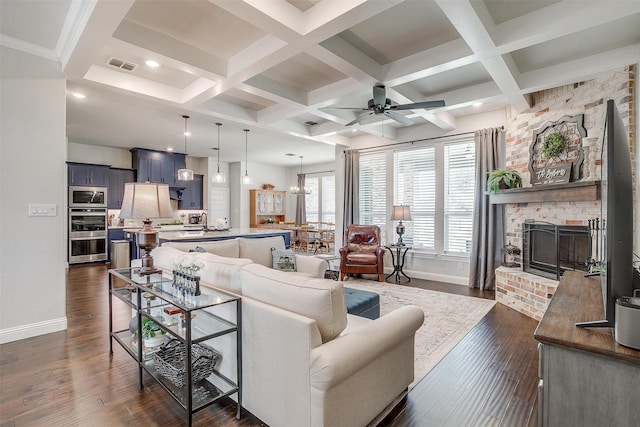 living area with visible vents, dark wood-type flooring, a fireplace, and coffered ceiling