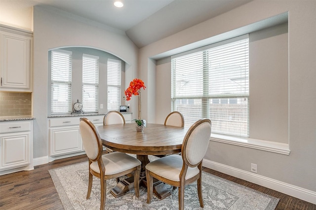 dining space featuring recessed lighting, baseboards, dark wood-type flooring, and vaulted ceiling