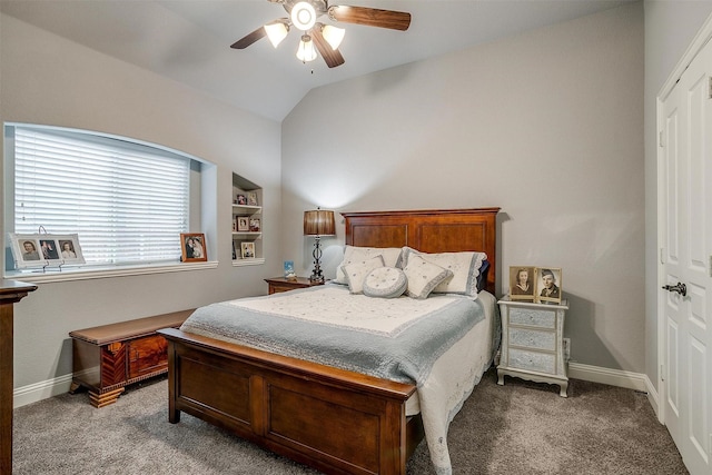 carpeted bedroom featuring vaulted ceiling, a ceiling fan, and baseboards