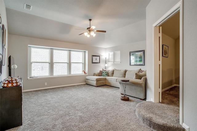 living area featuring visible vents, baseboards, carpet floors, lofted ceiling, and ceiling fan