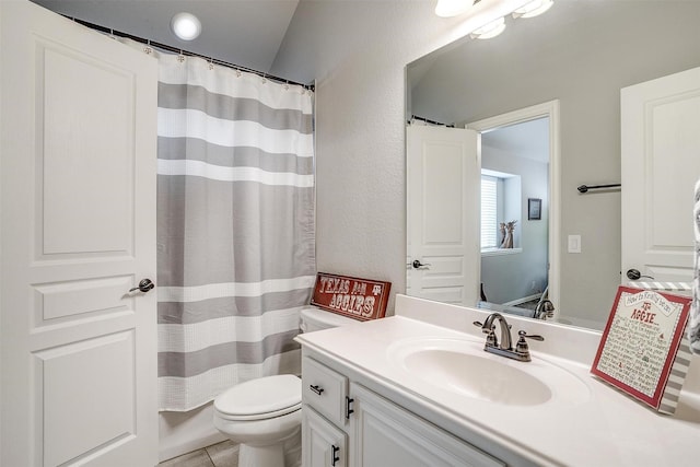 full bathroom featuring tile patterned floors, a shower with shower curtain, toilet, and vanity