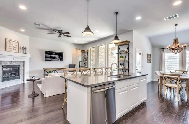 kitchen featuring a sink, visible vents, stainless steel dishwasher, and open floor plan