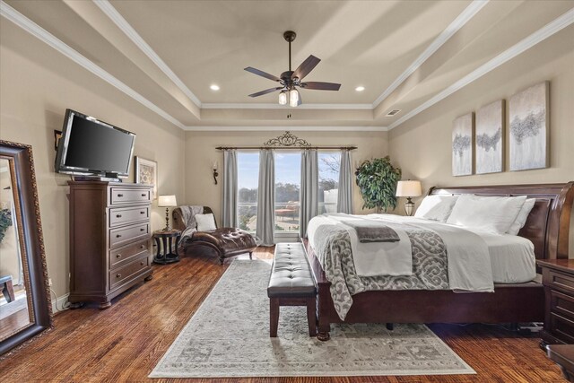 bedroom with access to exterior, crown molding, a raised ceiling, a ceiling fan, and dark wood-style flooring