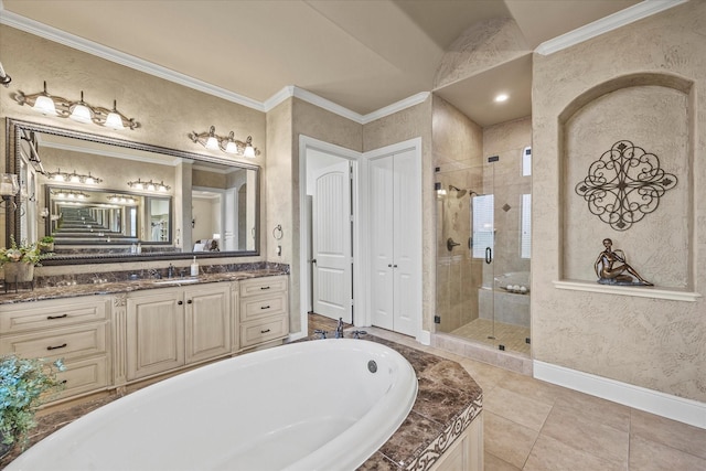 bathroom featuring vanity, baseboards, a shower stall, crown molding, and a bath