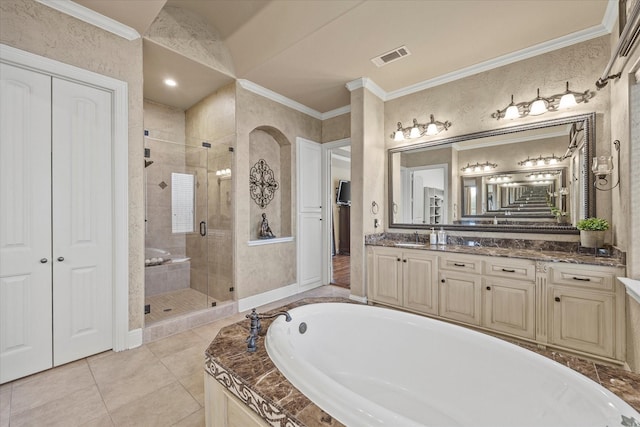 full bathroom featuring visible vents, a garden tub, a stall shower, crown molding, and vanity