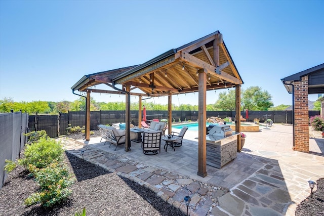 view of patio / terrace with a gazebo, a fenced in pool, a ceiling fan, and a fenced backyard