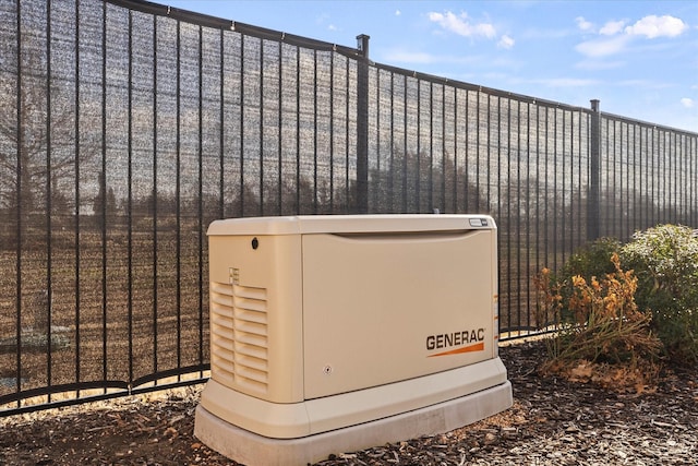 exterior details featuring a power unit and fence