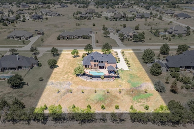 birds eye view of property with a residential view