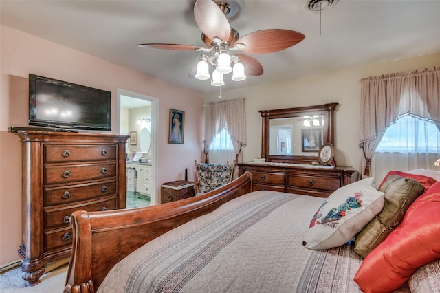 bedroom with a ceiling fan and ensuite bathroom