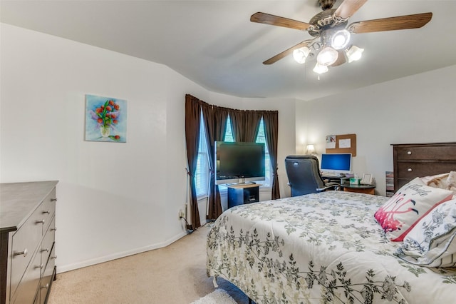 bedroom with baseboards, light carpet, and ceiling fan