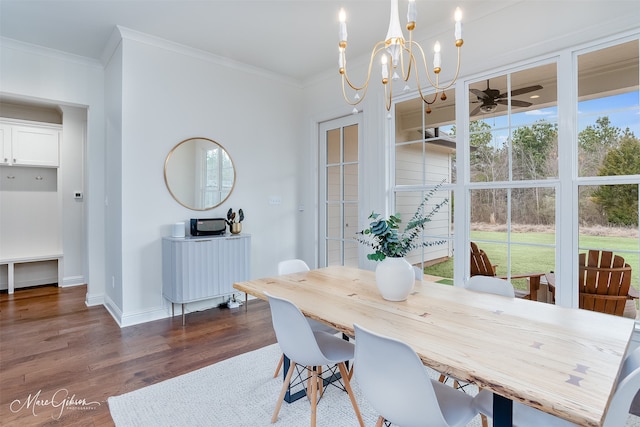 dining space featuring dark wood finished floors, plenty of natural light, baseboards, and ornamental molding