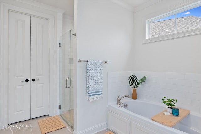 full bath featuring a bath, a shower stall, and tile patterned flooring