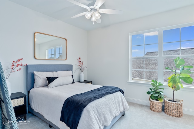 bedroom featuring baseboards, a ceiling fan, and carpet flooring