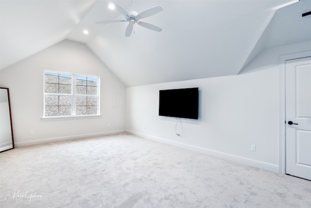 additional living space featuring baseboards, carpet floors, ceiling fan, and vaulted ceiling