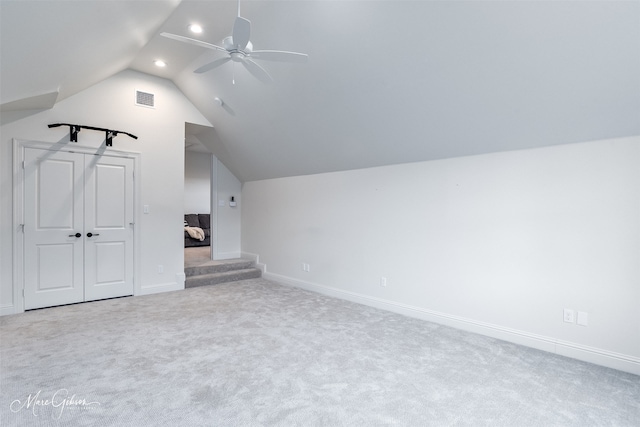 bonus room featuring visible vents, baseboards, ceiling fan, carpet floors, and vaulted ceiling