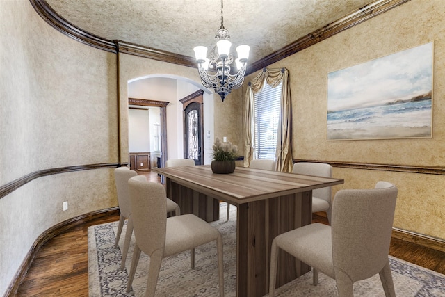 6620 Cedar Grove Dr, North Richland Hills, TX 76182 - dining space with arched walkways, ornamental molding, a chandelier, and wood finished floors
