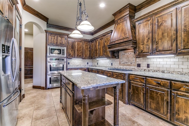 6620 Cedar Grove Dr, North Richland Hills, TX 76182 - kitchen with arched walkways, appliances with stainless steel finishes, premium range hood, ornamental molding, and light stone countertops