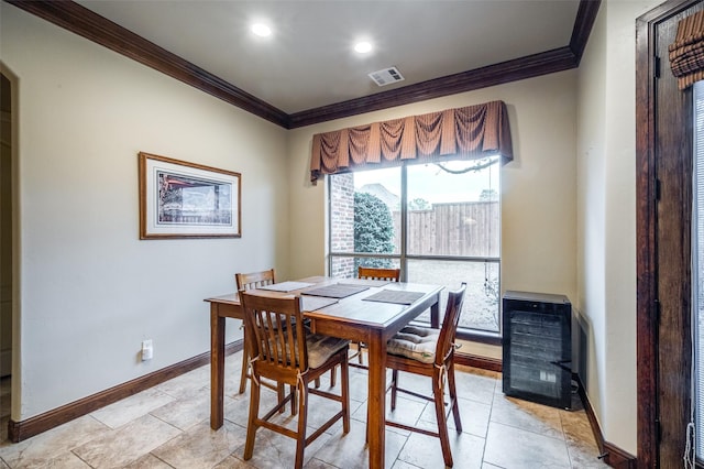 dining space with heating unit, baseboards, visible vents, recessed lighting, and ornamental molding