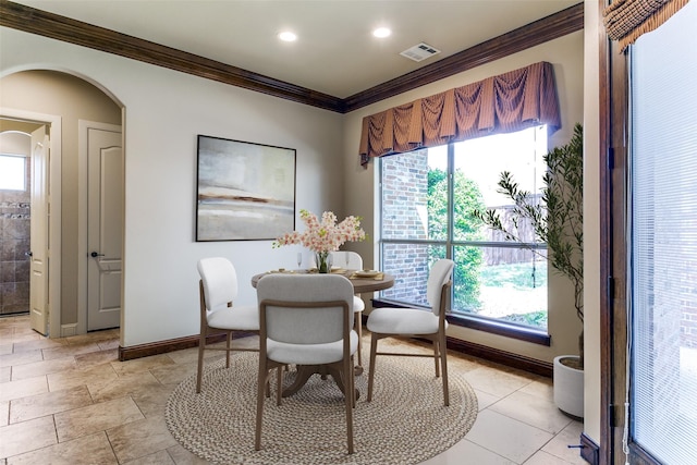 6620 Cedar Grove Dr, North Richland Hills, TX 76182 - dining room with arched walkways, crown molding, visible vents, and a wealth of natural light