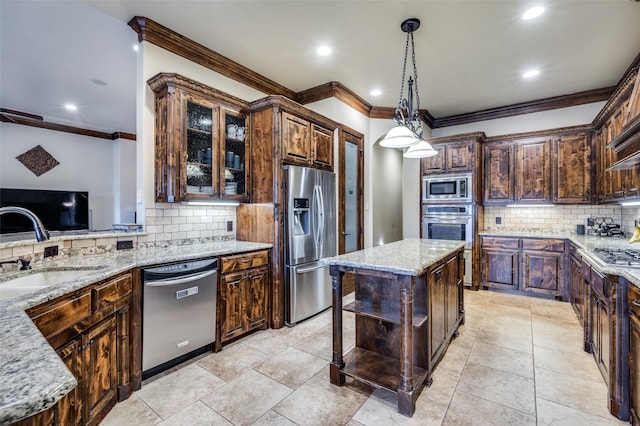 kitchen with crown molding, dark brown cabinetry, light stone counters, appliances with stainless steel finishes, and a sink