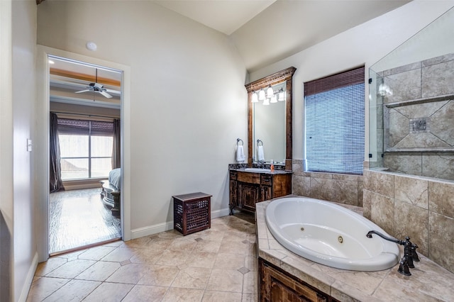 full bath with baseboards, tile patterned floors, a tub with jets, vanity, and a ceiling fan