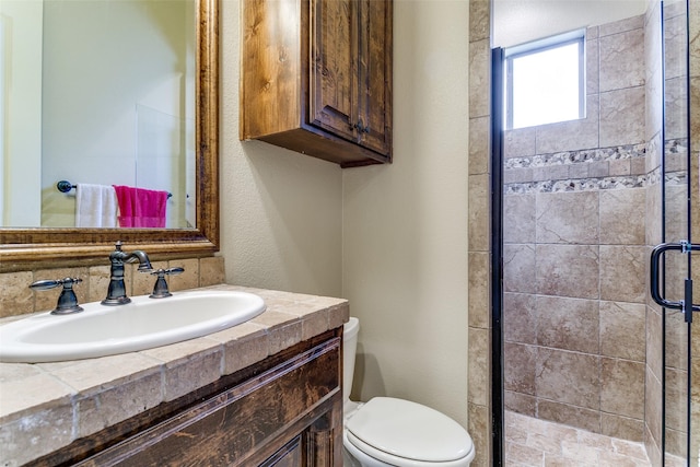 6620 Cedar Grove Dr, North Richland Hills, TX 76182 - bathroom featuring toilet, vanity, and a stall shower
