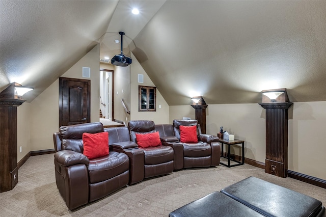 cinema with visible vents, baseboards, vaulted ceiling, a textured ceiling, and light colored carpet